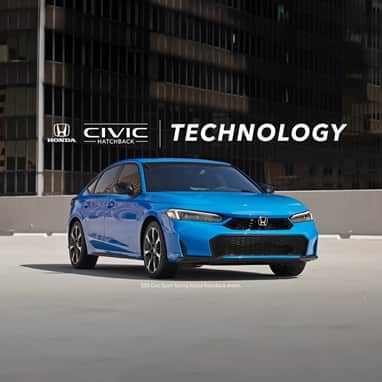 2026 Honda Civic Hatchback Sport Touring Hybrid in Boost Blue Pearl front parked on a rooftop parking lot(Compact Hatchback).